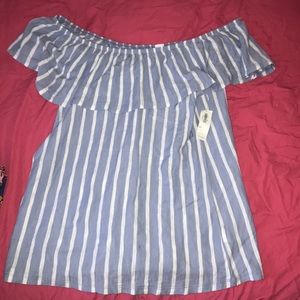 Off the shoulder blue and white striped shirt.